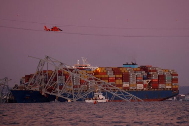 PHOTO: The cargo freighter after it hit the Baltimore bridge STORY: EXPLAINER: Why did the Baltimore bridge collapse?