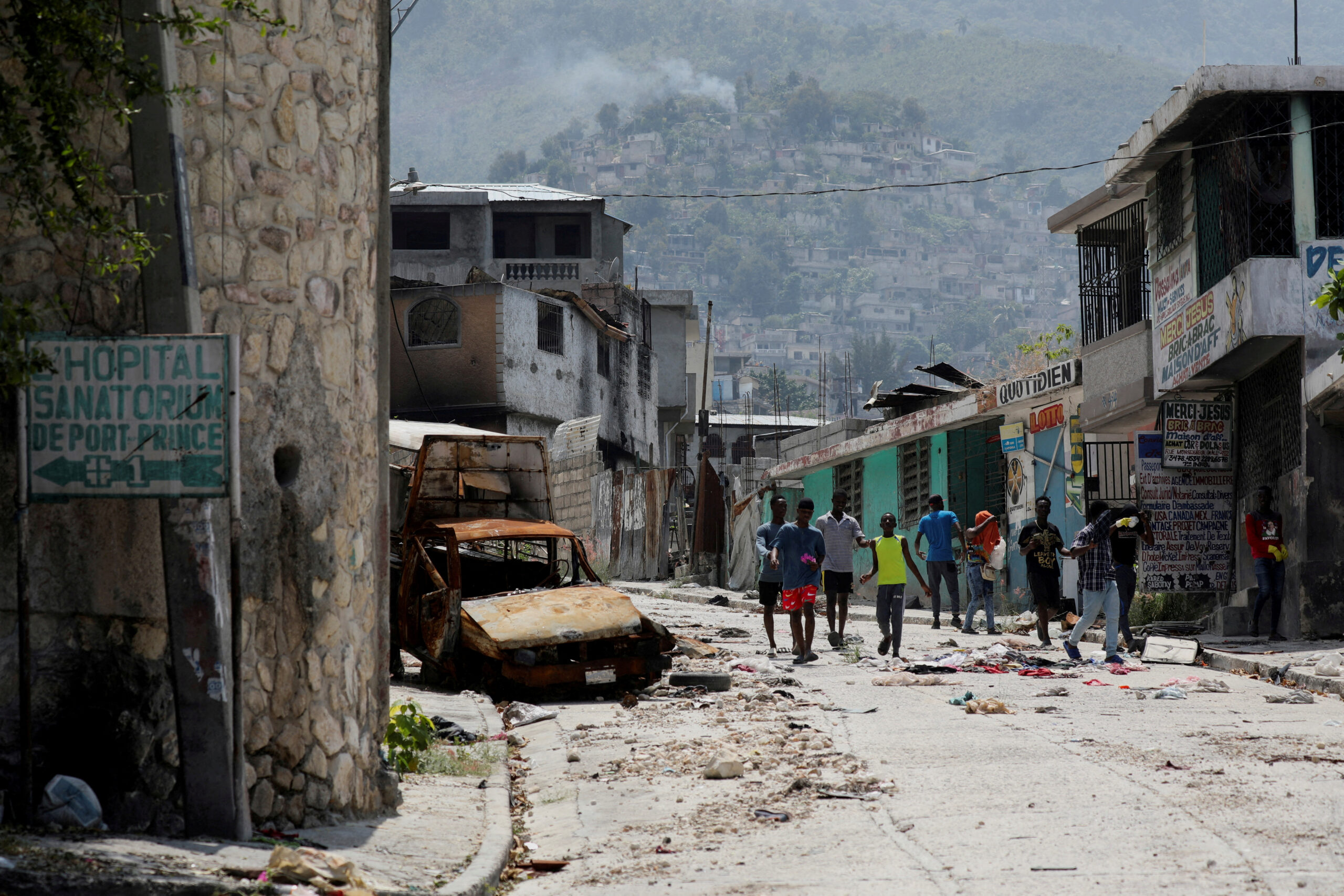 Haiti suspected gang members set on fire as conflict spreads to capital suburb