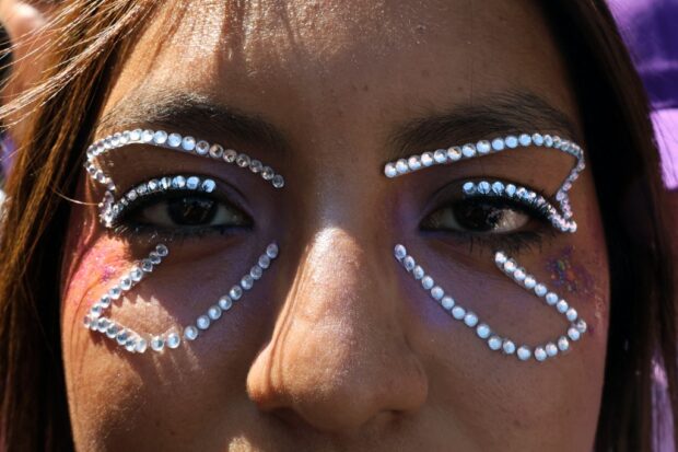 A demonstrator takes part in a march to mark the International Women's Day in Mexico City