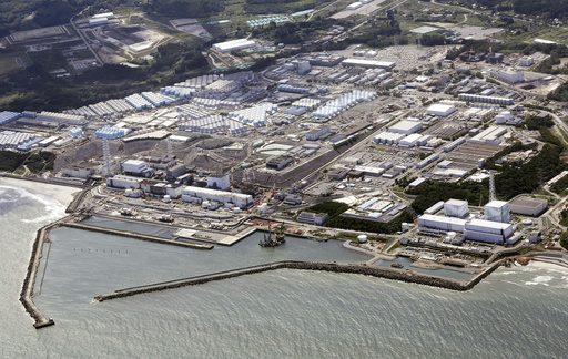 This aerial view shows the Fukushima Daiichi nuclear power plant in Fukushima, northern Japan, on Aug. 24, 2023, shortly after its operator Tokyo Electric Power Company Holdings TEPCO began releasing its first batch of treated radioactive water into the Pacific Ocean. Japan on Monday, March 11, 2024, marked 13 years since a massive earthquake and tsunami hit the country’s northern coasts. (Kyodo News via AP, File)