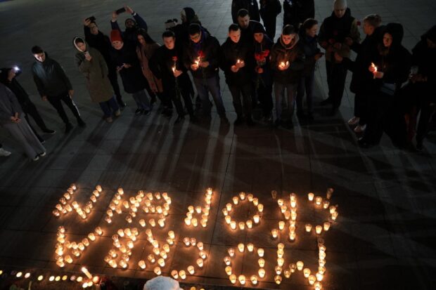 People lay flowers and lit candles in memory of the Moscow concert gun attack victims 