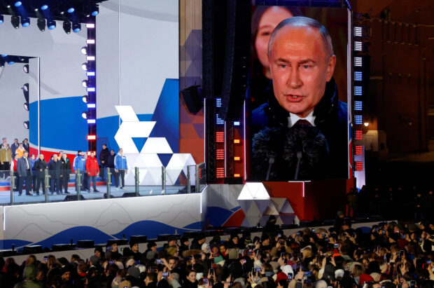 Russian incumbent President Vladimir Putin, who was declared winner of the presidential election by the country's electoral commission, delivers a speech during a rally