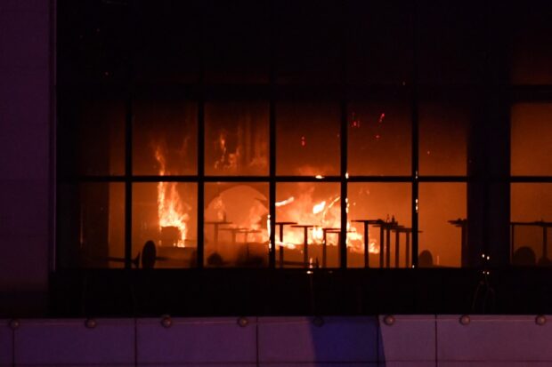 A view shows the burning Crocus City Hall concert hall following the shooting incident in Krasnogorsk, outside Moscow