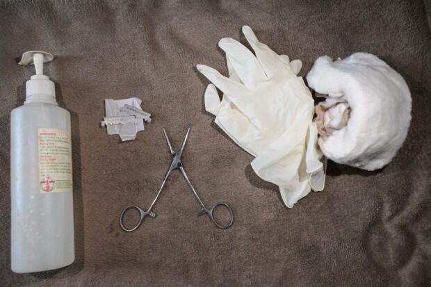 This photograph taken on November 30, 2023 shows the tools used to perform medicalized female genital mutilation (FGM) procedures 