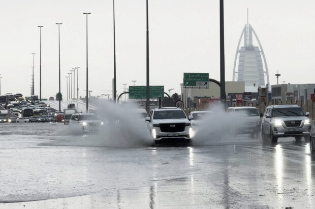 Heavy rains lashed the United Arab Emirates on Tuesday, flooding out portions of major highways and leaving vehicles abandoned on roadways across Dubai. 
