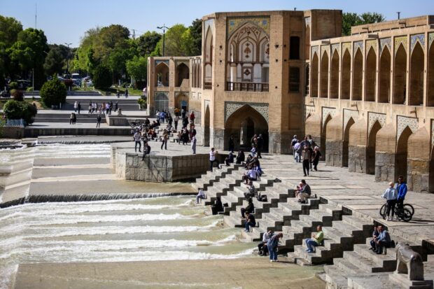 People visit the Khaju Bridge in Iran's central city of Isfahan on April 19, 2024.