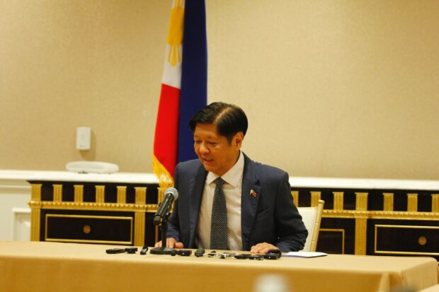 President Ferdinand Marcos Jr. walks toward a room in a Washington D. C. hotel, for a press briefing with members of the Philippine media delegation on April 12, 2024. Marcos addressed questions about the alleged gentleman’s agreement between China and former president Rodrigo Duterte, which he called a secret deal, during the press conference. Gabriel P. Lalu/ INQUIRER.net