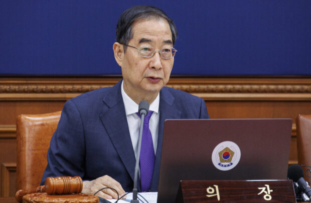 South Korea's Prime Minster Han Duck-soo speaks during a cabinet meeting 
