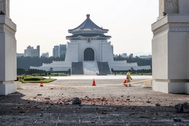 This photo taken by Taiwan's Central News Agency (CNA) on April 3, 2024 shows a barricade erected around debris in the compound of the Chiang Kai-shek Memorial Hall in Taipei 