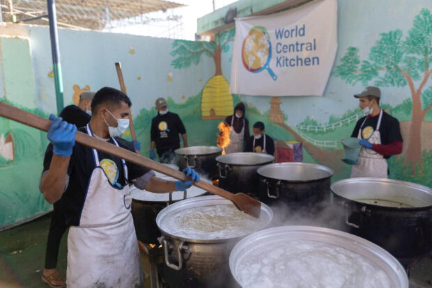 Members of "World Central Kitchen" prepare food for Palestinians, in the location given as Gaza