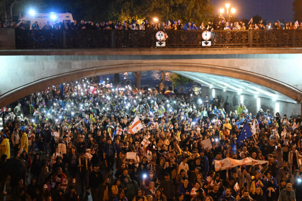 Protesters march during a rally against the controversial "foreign influence" bill in Tbilisi on May 11, 2024. The Black Sea Caucasus nation has been gripped by mass anti-government protests since April 9, after the ruling Georgian Dream party reintroduced the bill, which critics see as repressive. (Photo by Vano SHLAMOV / AFP)