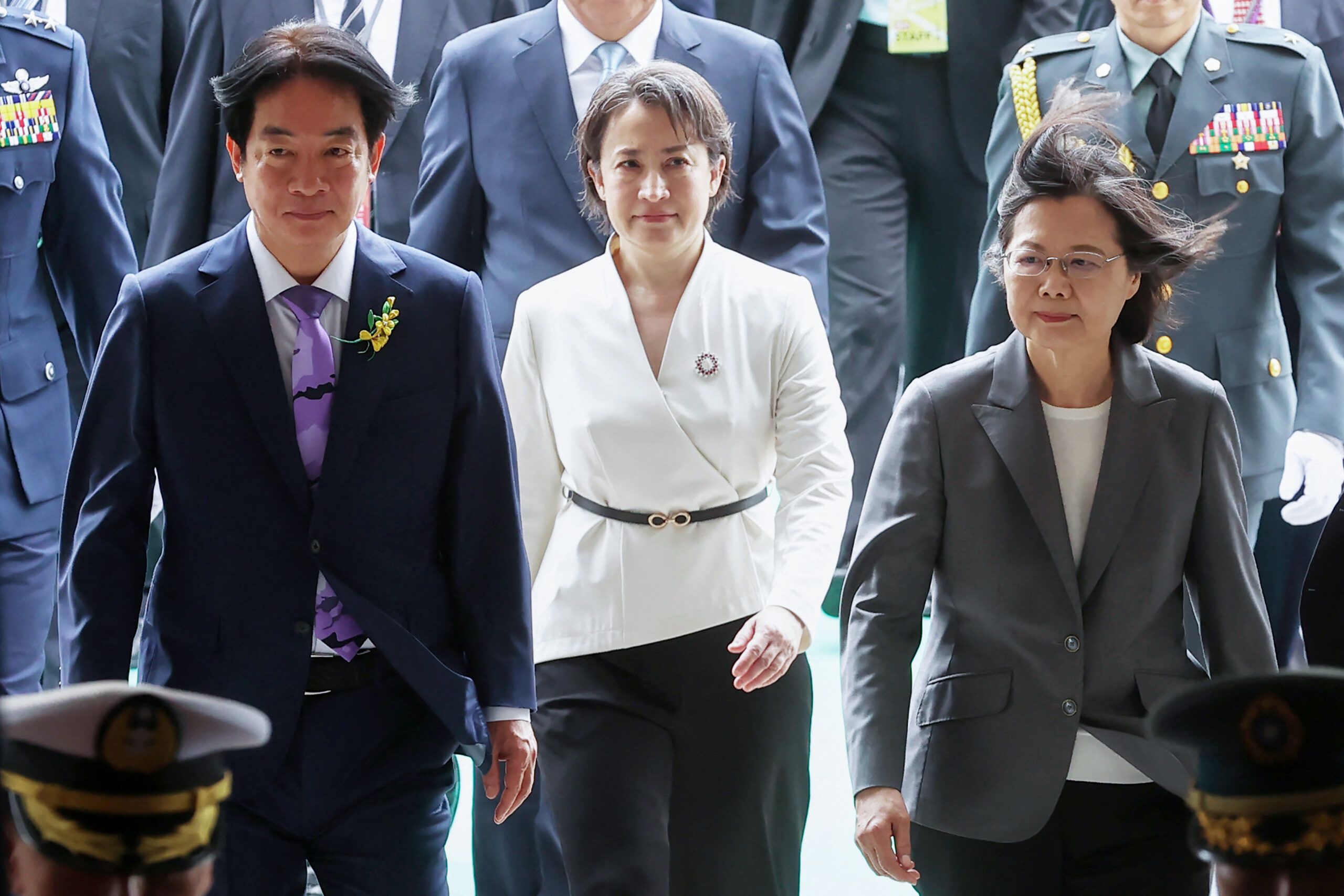 Taiwan's President Lai Ching-te (L), Vice President Hsiao Bi-khim (R) and former president Tsai Ing-wen (L) walking during the inauguration ceremony at the Presidential Office Building in Taipei.