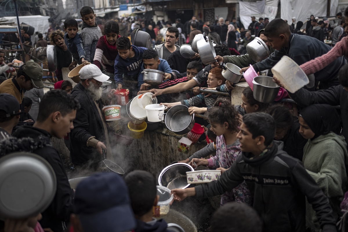 PHOTO: Palestinians line up for a meal in Rafah, Gaza Strip, Dec. 21, 2023. Israel and Hamas appear to be seriously negotiating an end to the war in Gaza and the return of Israeli hostages. STORY: Cease-fire talks: Israel, Hamas seem intent on ending war