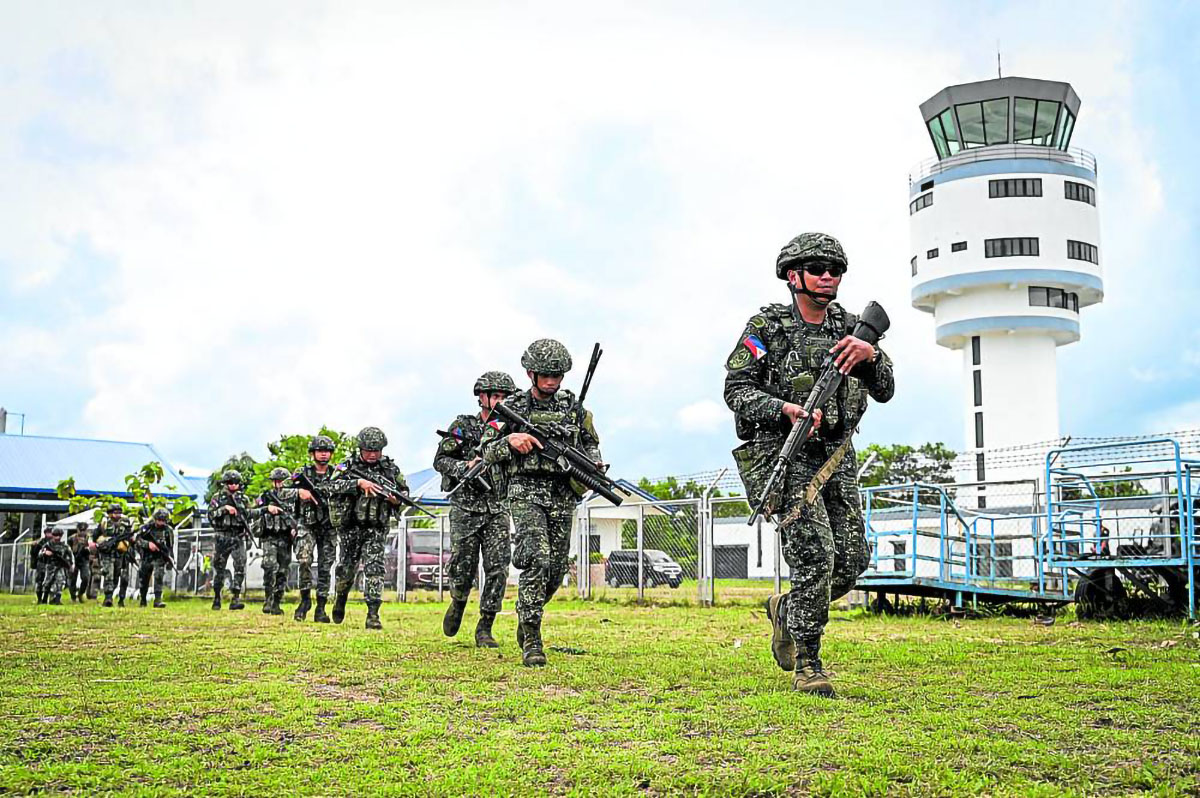 Soldiers conduct an airfield seizure exercise as part of the US-Philippines “Balikatan” joint military exercise at San Vicente Airport in Palawan province on Wednesday