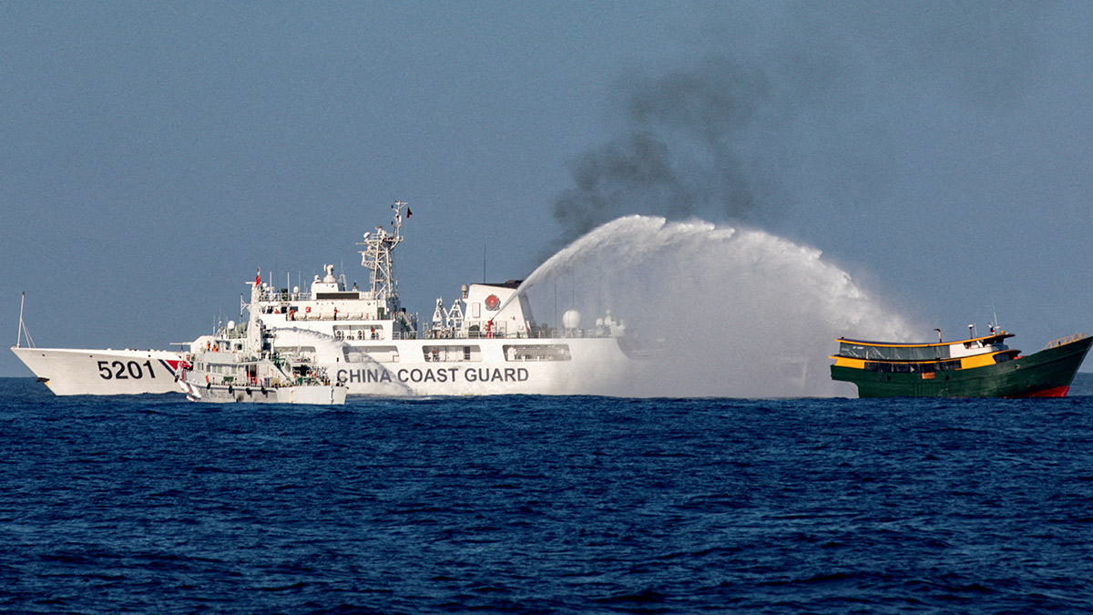 WATER BLAST AChinese Coast Guard vessel fires its water cannon at the Philippine resupply vessel UnaizahMay 4 on its way to a resupply mission at Ayungin (Second Thomas) Shoal in theWest Philippine Sea in this photo taken on March 5. —REUTERS
