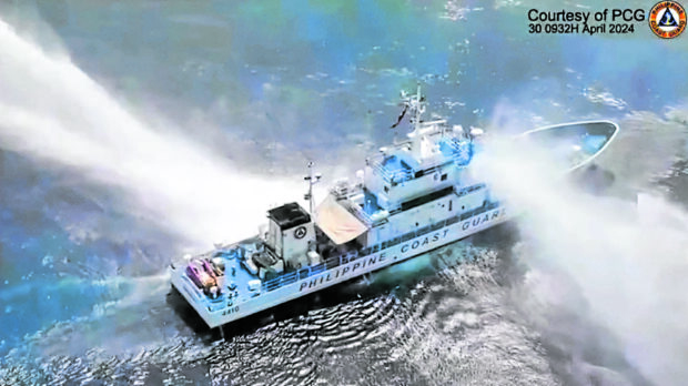 ‘NOT ONLY SHOCKING BUT APPALLING’ A frame grab from video footage released by the Philippine Coast Guard shows its ship, the BRP Bagacay, being hit by water cannon from Chinese coast guard vessels near the Chinese-controlled Scarborough Shoal in the West Philippine Sea. Also hit on its way to the shoal was the BRP Bankaw of the Bureau of Fisheries and Aquatic Resources. —AFP