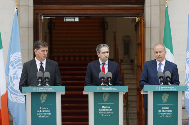 The three Irish Government leaders from left, Minister Eamon Ryan, Taoiseach Simon Harris and Tanaiste Micheal Martin speak to the media during a press conference outside the Government Buildings, in Dublin, Ireland, Wednesday May 22, 2024. 