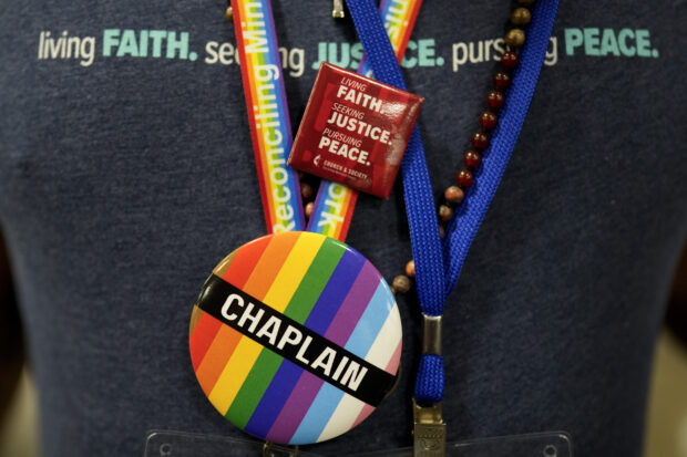 A convention goer wears a button supporting LGBTQ clergy at the United Methodist Church General Conference Wednesday, May 1, 2024, in Charlotte, N.C.