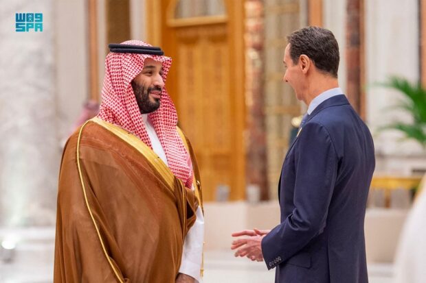 This handout picture provided by the Saudi Press Agency (SPA) on November 11, 2023, shows Saudi Crown Prince Mohammed bin Salman (L) speaking with Syria's president Bashar al-Assad during an emergency meeting of the Arab League and the Organisation of Islamic Cooperation (OIC), in Riyadh.