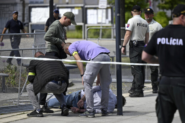 Police arrest a man after Slovak Prime Minister Robert Fico was shot and injured following the cabinet's away-from-home session in the town of Handlova, Slovakia, Wednesday, May 15, 2024. 