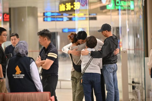 SIA relief flight with passengers and crew members of SQ321 arrives in Singapore