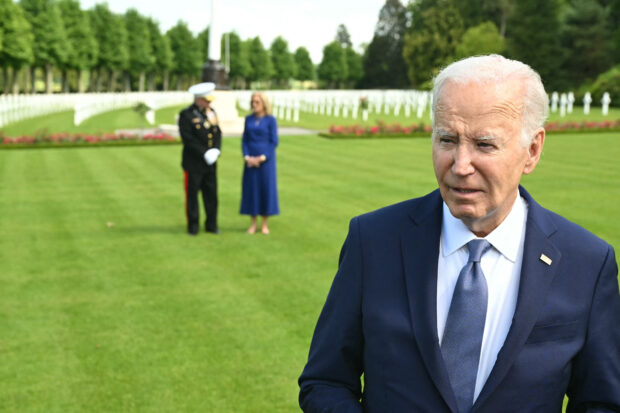US President Joe Biden and First Lady Jill Biden (C) visit the Aisne-Marne American Cemetery to pay tribute to fallen US soldiers of the World War I, in Belleau, Northern France, on June 9, 2024. 