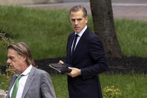Hunter Biden (R), son of US President Joe Biden, exits the J. Caleb Boggs Federal Building on June 10, 2024 in Wilmington, Delaware. Jury deliberations began on Monday in Hunter Biden's trial on federal gun charges, US media reported. Biden, 54, the son of US President Joe Biden, is accused of lying about his illegal drug use when he bought a handgun in 2018. 