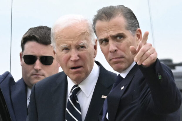 US President Joe Biden talks with his son Hunter Biden upon arrival at Delaware Air National Guard Base in New Castle, Delaware, on June 11, 2024, as he travels to Wilmington, Delaware. A jury found Hunter Biden guilty on June 11 on federal gun charges in a historic first criminal prosecution of the child of a sitting US president. 