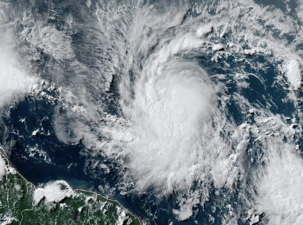 This National Oceanic and Atmospheric Administration (NOAA)/GOES satellite handout image shows Tropical Storm Beryl at 19:30UTC on June 29, 2024. Much of the southeast Caribbean went on alert Saturday as Tropical Storm Beryl was set to undergo rapid strengthening, becoming a "dangerous" major hurricane before it crosses the Windward Islands sometimes on June 30, forecasters said.Barbados, St Lucia, St Vincent and the Grenadines and Grenada all had hurricane watches in place, the US National Hurricane Center said, as Beryl swirled in the Atlantic. (Photo by HANDOUT / NOAA/GOES / AFP) 