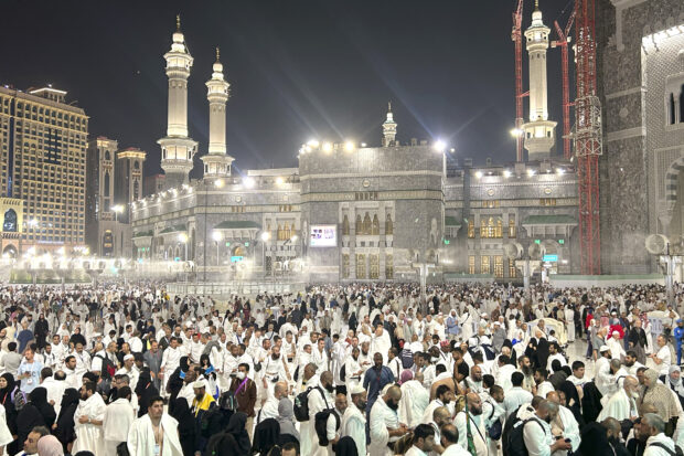 Pilgrims leave after offering prayers outside at the Grand Mosque during the annual Hajj pilgrimage in Mecca, Saudi Arabia, early Friday, June 14, 2024. Hajj is the annual Islamic pilgrimage to Mecca in Saudi Arabia that is required once in a lifetime of every Muslim who can afford it and is physically able to make it. Some Muslims make the journey more than once.