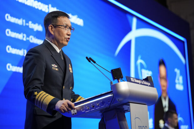 China's Defense Minister Dong Jun speaks during the 21st Shangri-La Dialogue summit at the Shangri-La Hotel in Singapore, Sunday, June 2, 2024.