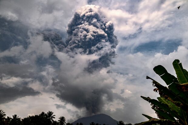 This handout picture taken and released on May 21, 2024 by the Indonesian Geological Agency shows Mount Ibu spewing volcanic ash as seen from the monitoring post in West Halmahera, North Maluku.