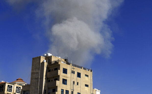 Smoke billows following an air strike in the Yemeni capital Sanaa on May 16, 2019. Warplanes struck the rebel-held Yemeni capital two days after the insurgents claimed drone strikes that shut a key oil pipeline in neighbouring Saudi Arabia, the rebels and witnesses said. One witness told AFP he heard a loud explosion in the heart of Sanaa. The rebels' Al-Masirah television blamed "aircraft of the (Saudi-led) aggression". (Photo by Mohammed HUWAIS / AFP)