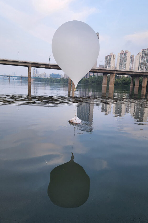 This handout photo taken on June 9, 2024 and provided by the South Korean Defence Ministry shows an unidentified object believed to be a North Korean trash-filled balloon, on the surface of the Han River near Jamsil Bridge in Seoul. North Korea has sent hundreds more trash-filled balloons across the border in a fresh blitz, Seoul's military said on June 9, as the tit-for-tat balloon barrages between the two neighbours accelerates. (Photo by Handout / South Korean Defence Ministry / AFP) 