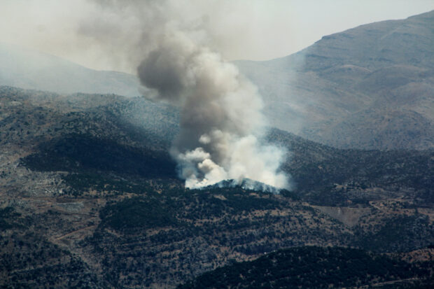 Smoke billows from forest fires near the southern Lebanese village of Shebaa, close to the northern border of Israel, following the shooting down of a drone by  the Israeli army on July 4, 2024, amid the ongoing cross-border clashes between Israeli troops and Hezbollah fighters. Lebanon's Hezbollah said it launched more than 200 rockets and explosive drones on June 4, at Israeli military positions as tensions have soared amid the almost nine-months-old Gaza war.