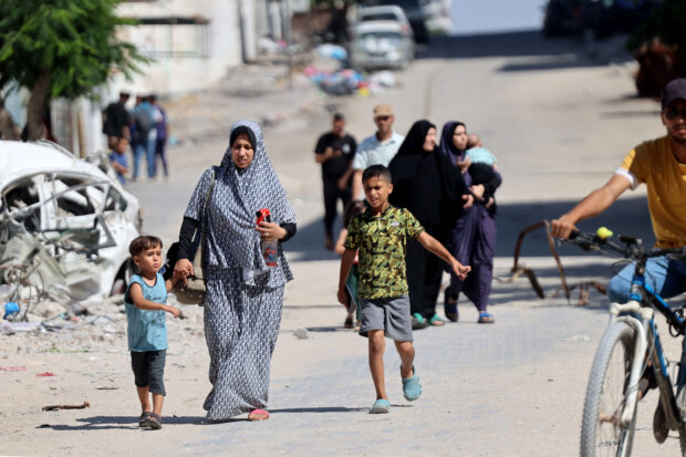 Palestinians flee the area following a warning by the Israeli military to evacuate during the Israeli military bombardment of Gaza City on July 7, 2024, amid the ongoing conflict in the Palestinian territory between Israel and Hamas. The fighting and bombardment in besieged Gaza Strip raged on unabated, with medics and emergency services in the Hamas-run territory reporting yet more deaths in several strikes on July 7, as Israel's war against Hamas militants entered its 10th month, with diplomatic efforts underway to secure a ceasefire and hostage release deal.