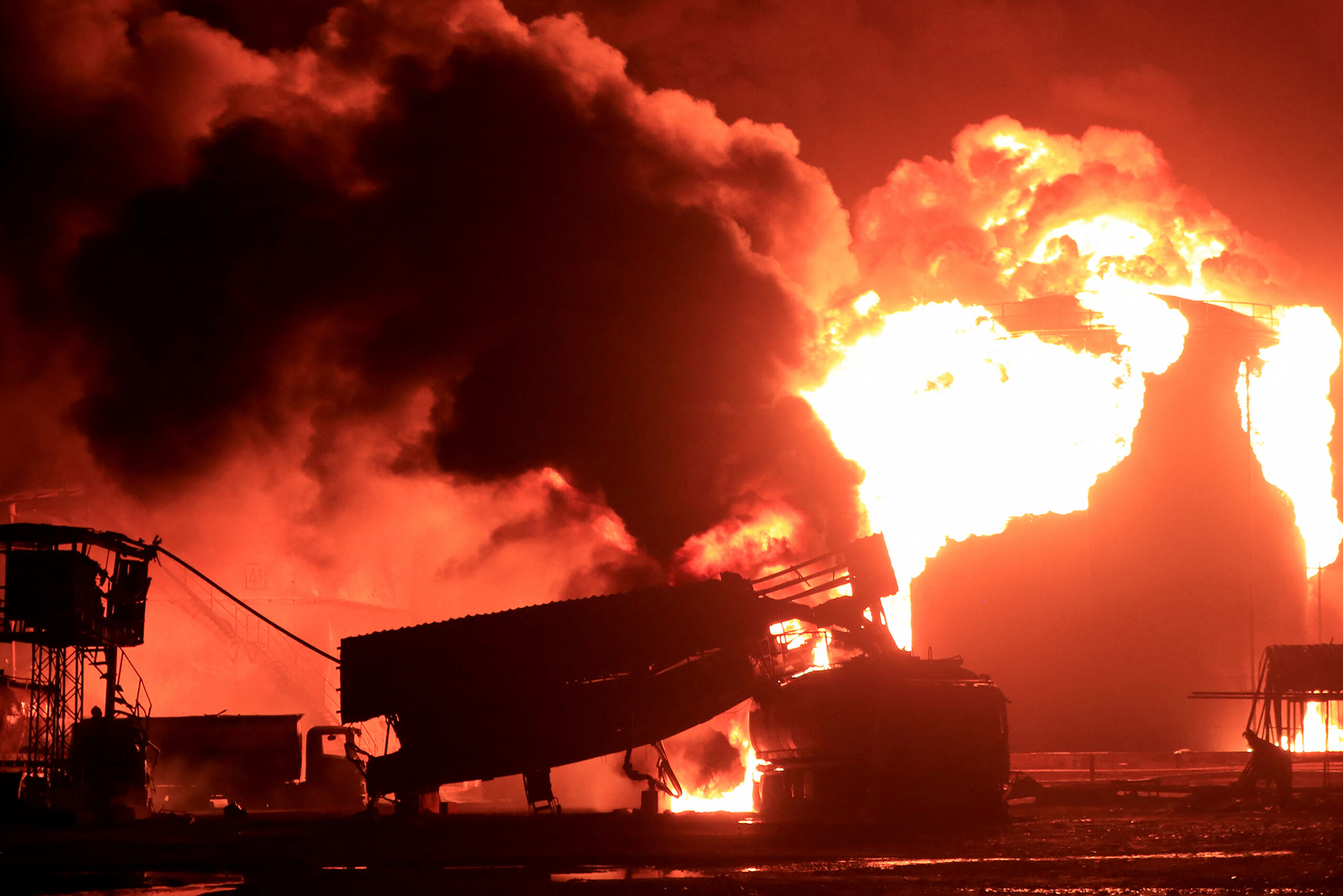 A giant fire erupts at an oil storage facility following Israeli strikes in Yemen's Huthi-held port city of Hodeida on July 20, 2024.