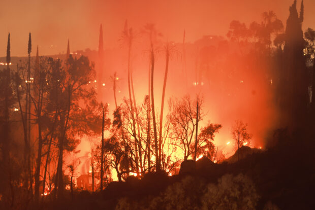 Homes are threated as the Hawarden Fire burns in Riverside, California, July 21, 2024.