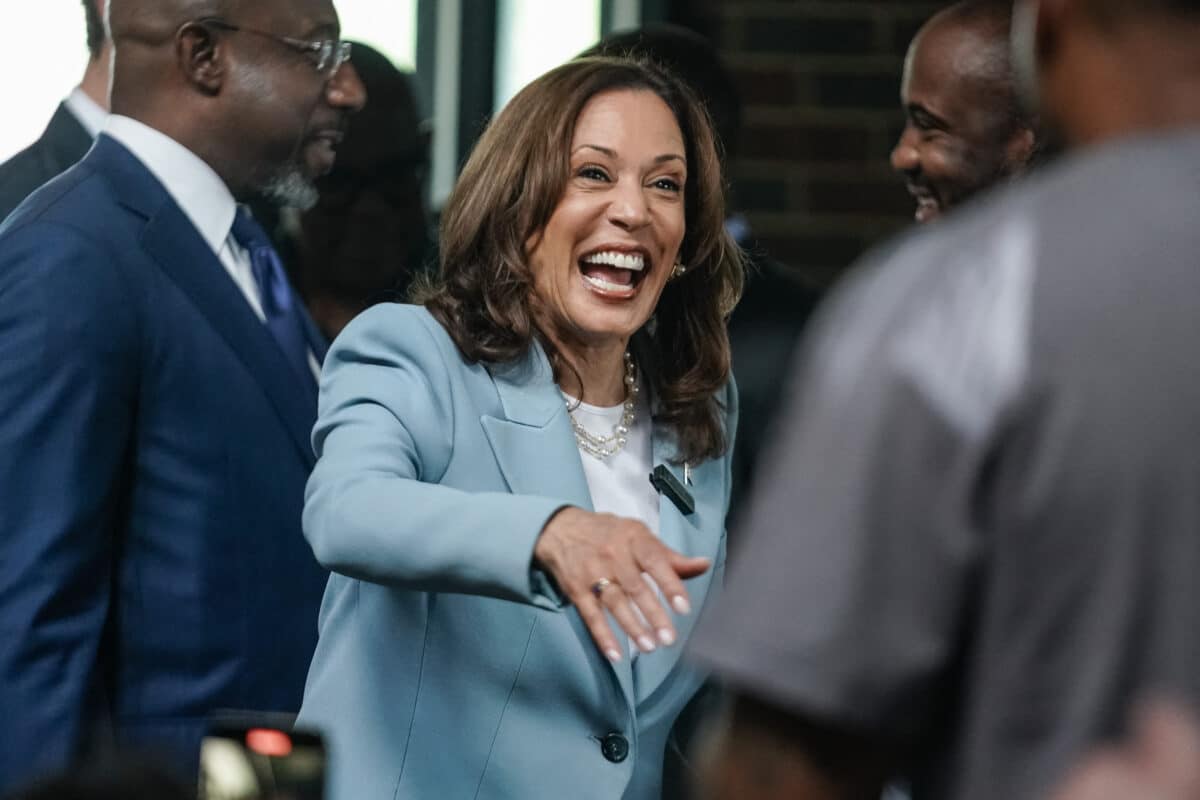 US Vice President and 2024 Democratic presidential candidate Kamala Harris greets people during a campaign stop at Paschal's, a historic Black-owned restaurant, in Atlanta, Georgia, on July 30, 2024. (Photo by Elijah Nouvelage / POOL / AFP)