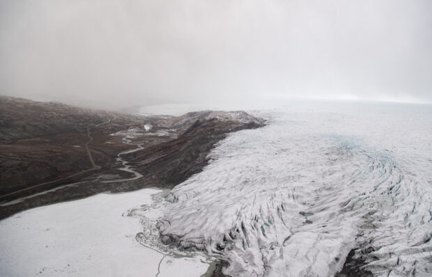 Ice recedes from a glacier as seen from an aerial helicopter tour with US Secretary of State Antony Blinken of ice caps and fjords near Kangerlussuaq, Greenland, May 20, 2021. 