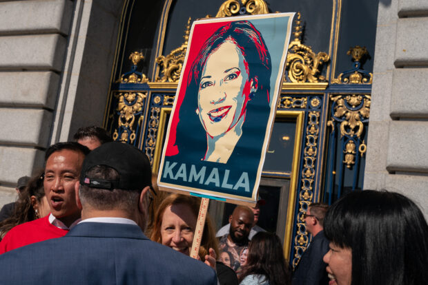 A supporter holds a sign as members of the San Francisco Democratic Party rally in support of Kamala Harris, following the announcement by US President Joe Biden that he is dropping out of the 2024 presidential race, on July 22, 2024 at City Hall in San Francisco, California. Biden has endorsed Harris to be the Democratic nominee. 