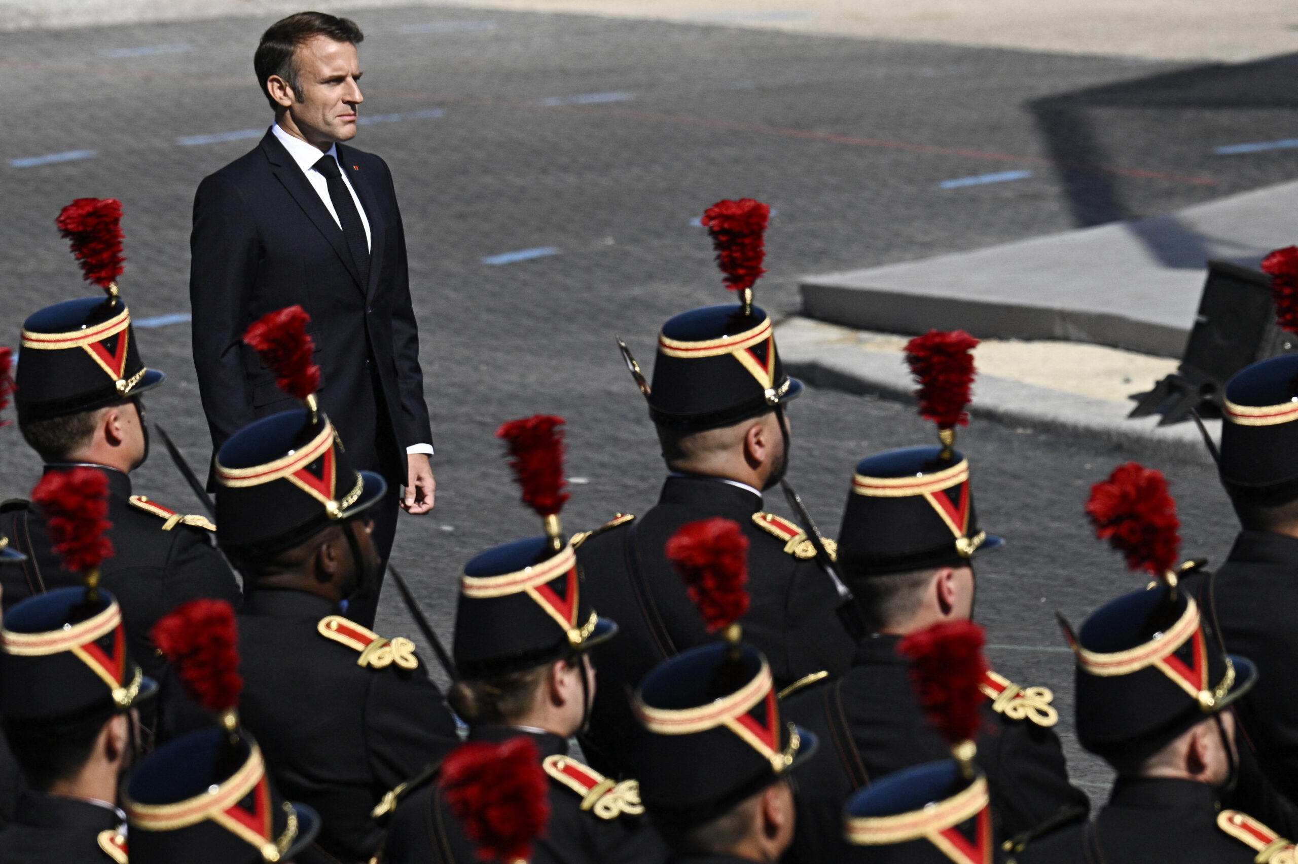 France celebrates national day as political crisis rumbles on