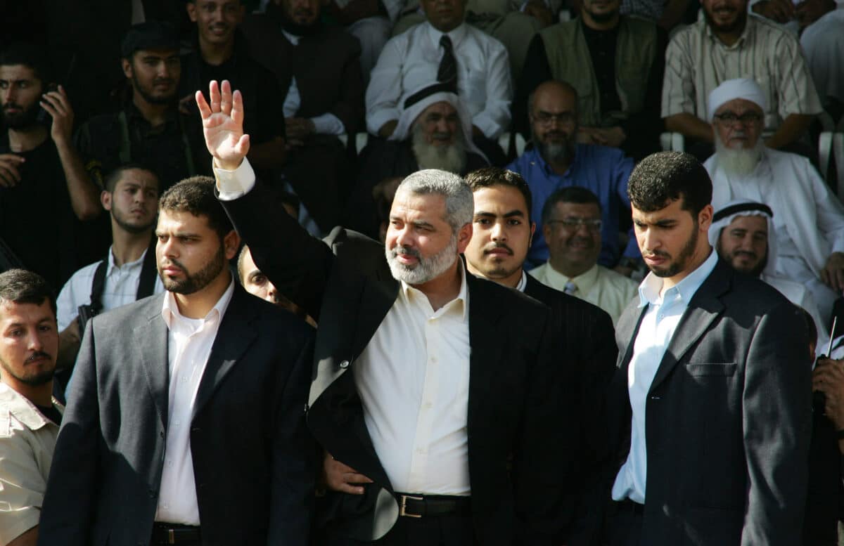  Palestinian Prime Minister Ismail Haniyeh waves to Hamas supporters during a rally in Gaza City, 6 October 2006. 