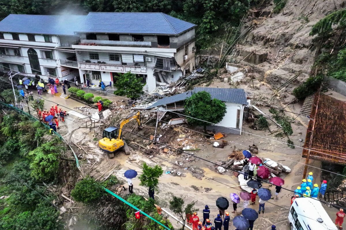 This photo taken on July 28, 2024 shows rescuers working at the site of a landslide in Hengyang, in central China's Hunan province. 