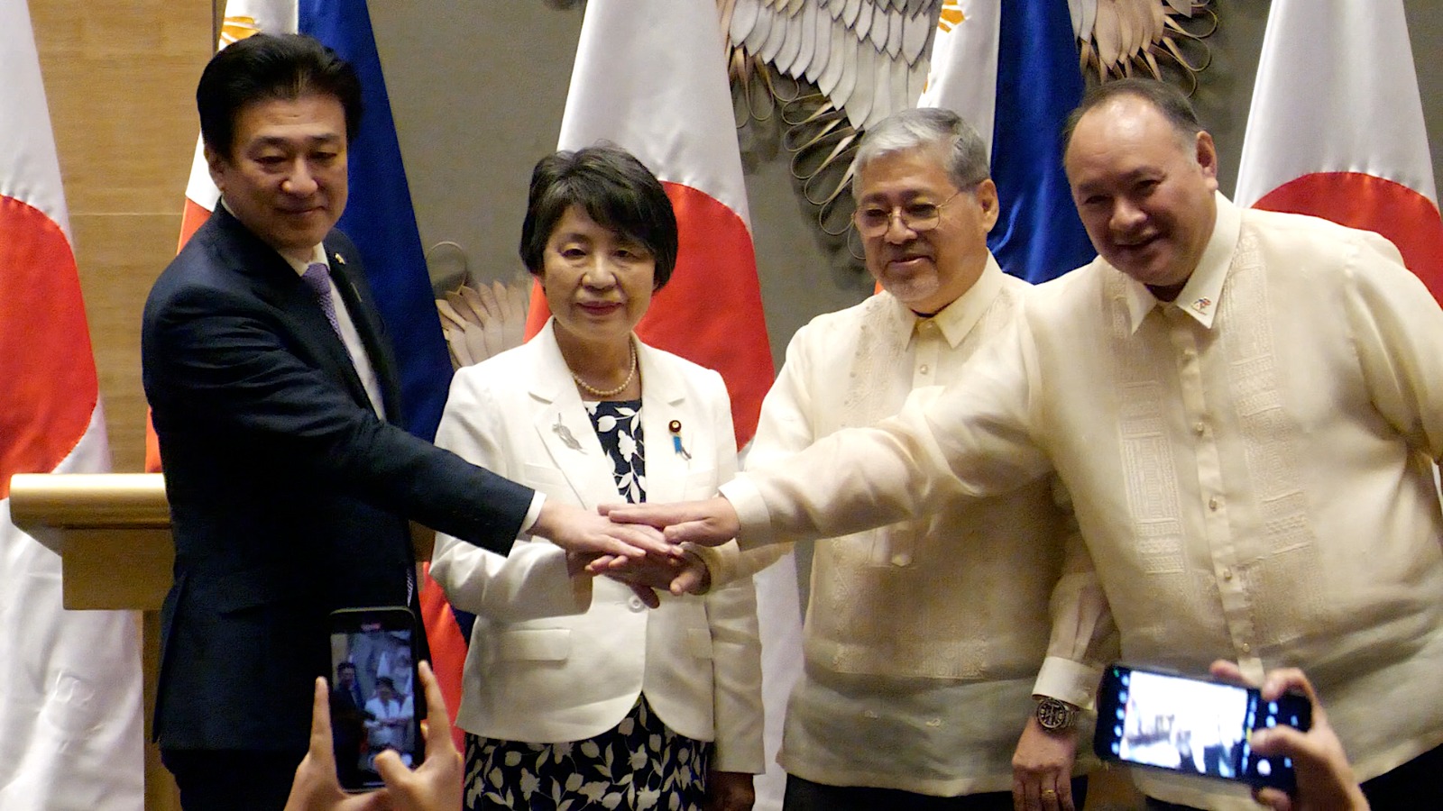 (From left to right) Japanese Defense Minister Minoru Kihara, Japanese Foreign Minister Yoko Kamikawa, Philippines Secretary of Foreign Affairs Enrique A. Manalo, and Philippines Secretary of National Defense Gilberto C. Teodoro join hands after a press conference during the 2nd Philippines-Japan Foreign and Defense Ministerial Meeting (2+2) at Shangri-La The Fort in Taguig City on Monday, July 8, 2024. Ryan Leagogo/INQUIRER.net