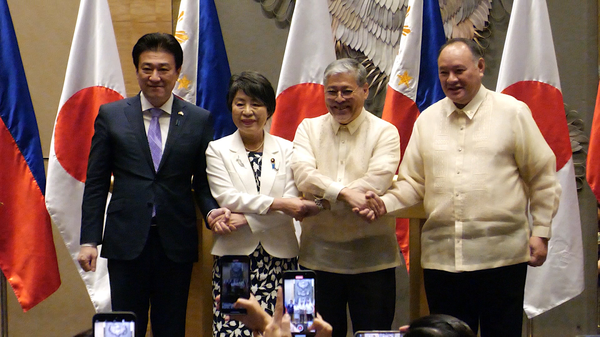 (From left to right) Japanese Defense Minister Minoru Kihara, Japanese Foreign Minister Yoko Kamikawa, Philippines Secretary of Foreign Affairs Enrique A. Manalo, and Philippines Secretary of National Defense Gilberto C. Teodoro holding each other's crossed hands after a press conference during the 2nd Philippines-Japan Foreign and Defense Ministerial Meeting (2+2) at Shangri-La The Fort in Taguig City on Monday, July 8, 2024. Ryan Leagogo/INQUIRER.net