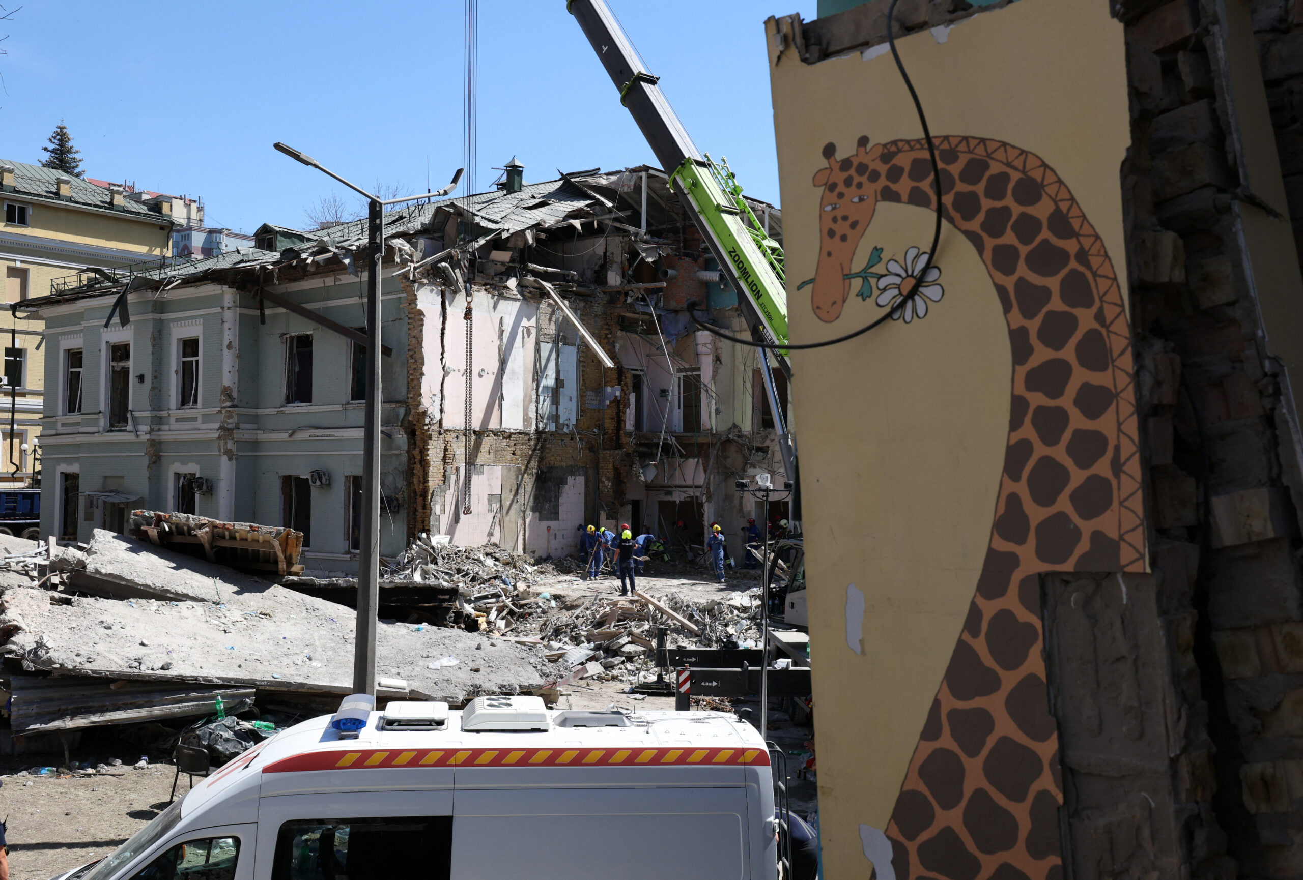 Mourning in Kyiv as rescuers clear rubble from children's hospital