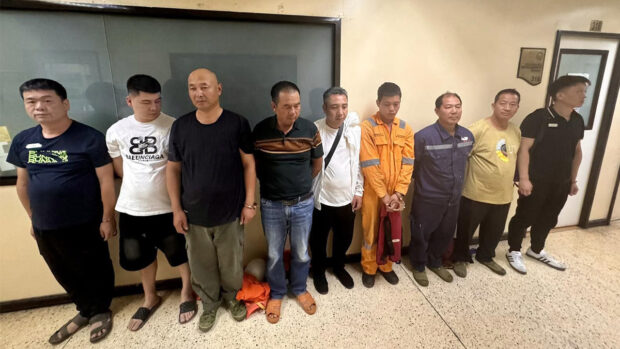 VISA CONDITIONS VIOLATED The nine Chinese nationals, who were arrested for violating the conditions of their stay in the Philippines, have been turned over to the Bureau of Immigration’s detention facility in Taguig City. —PHOTO FROMBUREAU OF IMMIGRATION