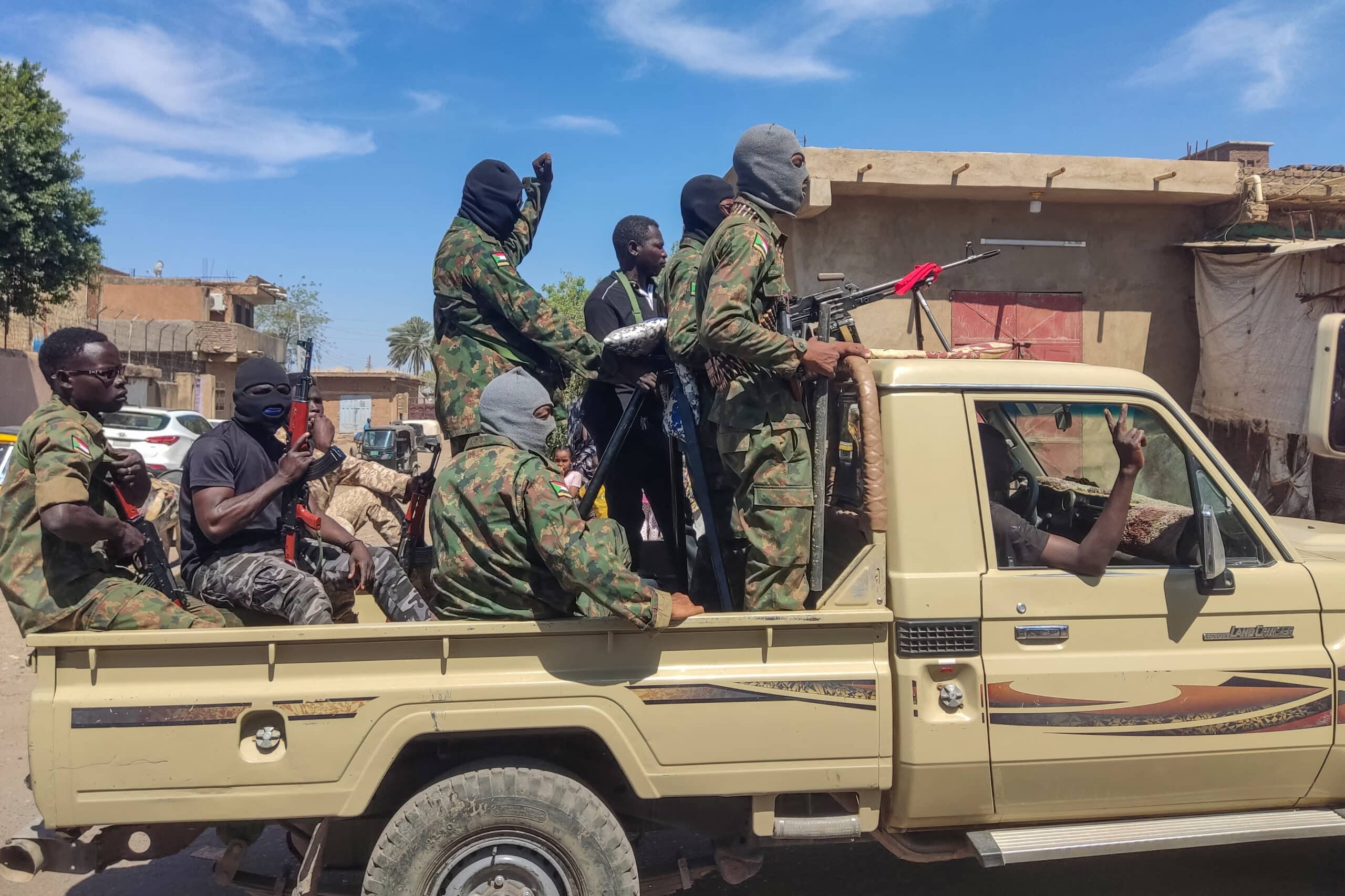 Supporters of the Sudanese armed popular resistance, which backs the army, ride on trucks in Gedaref in eastern Sudan on March 3, 2024, amid the ongoing conflict in Sudan between the army and paramilitaries. The war-torn country of Sudan is currently ravaged by internal fighting between the Sudanese Army and the paramilitary Rapid Support Forces (RSF). (Photo by AFP)