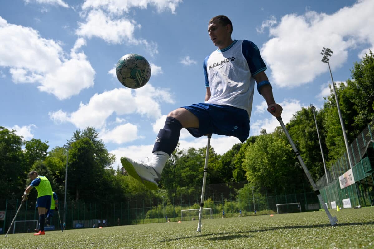 A player from FC Pokrova Lviv AMP, the first Ukrainian football team made up of military personnel with leg amputations as a result of hostilities, controls the ball during a training session in Lviv, on June 15, 2024, amid the Russian invasion of Ukraine. (Photo by YURIY DYACHYSHYN / AFP)